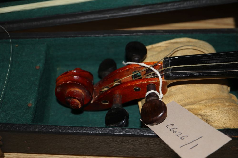A 20th century Antonius Stradivarius Cremonensis violin, cased with two bows